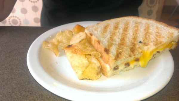 Grilled cheese panini with kettle chips.