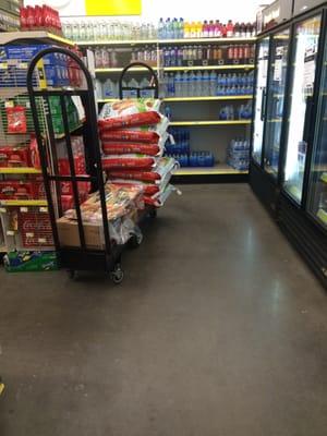 Empty shelves and cart on the floor.