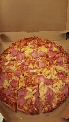 Medium ham and pineapple pizza on thin crust