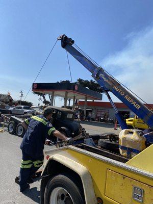 Safely assisting a vintage barn find Model A snatch blocking it onto a rented trailer. Another happy customer!