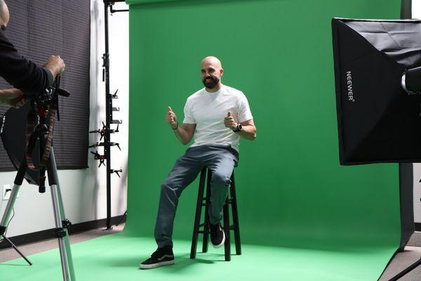 Green screen set up for full body capture and chroma key compositing.