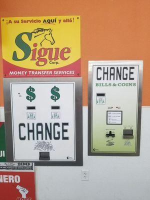 Both machines make change for 1,2,5,10,20 $ bills. The change machine on the right gives bills and coins as change for 10&20 dollar bills.