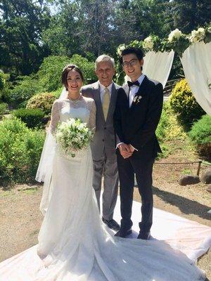 Wedding Officiant with happy couple