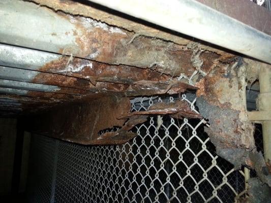 Jagged edges of rusty metal in the dig enclosures.