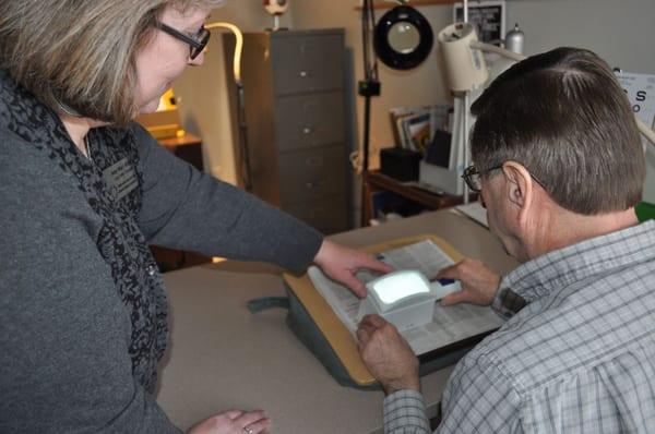 Low Vision Therapist Amy Wurf administering a Low Vision Evaluation