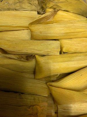 Chicken with green sauce , and pork with red sauce tamales. So good