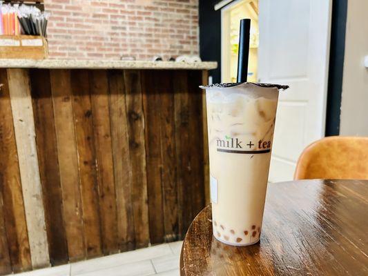 Delicious mango milk tea with golden boba! Always great here! Reg ice & half sugar!