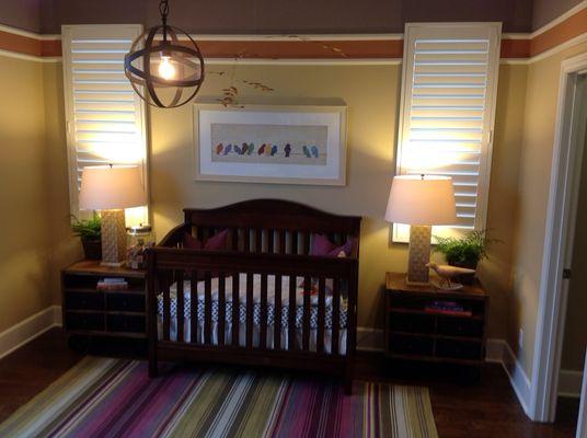 Hidden tilt shutters in baby nursery.  Perfectly safe as blinds with cords can be a hazard for children.