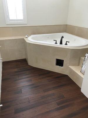 Upgraded flooring in new master bathroom