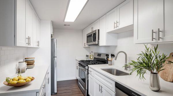 Enjoy stainless steel appliances and fresh white cabinetry in your kitchen