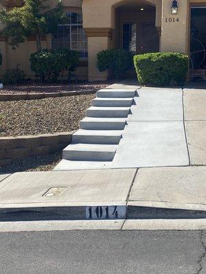 Steps on front yard with driveway extension