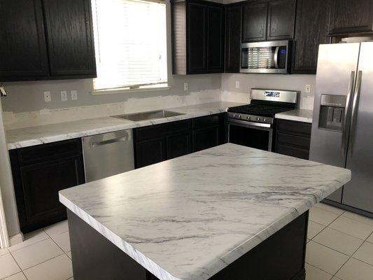 Countertops installed (I patched the walls)