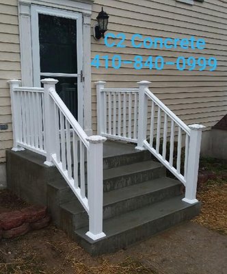 New porch stoop and steps with railing