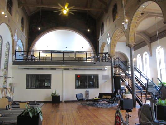 Sanctuary Bodyworks is in a former Catholic Church. The Rolfing Studio is at the top of the stairs.