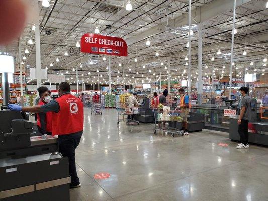 Self-check out staff at each register  to help get thru faster.