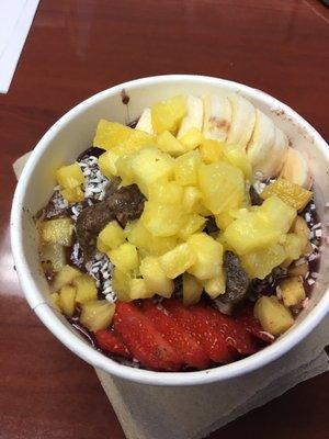 sunset harbour açaí bowl with coconut flakes under the fruit!