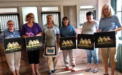 this was a beginning oil painting class -- proud students with their finished "three baby birds" painting!