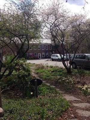 Cute garden area has benches and stepping stone pathways ... Great spot for a study break!