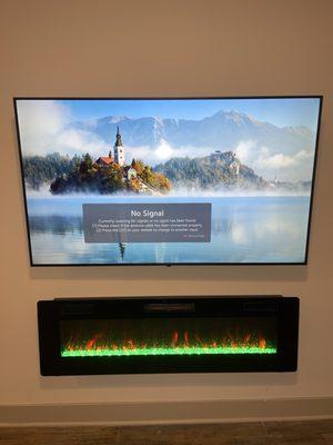 Tv an fireplace mounting with wires hidden