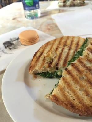 Delicious artichoke and spinach grilled cheese with a peach macaron!