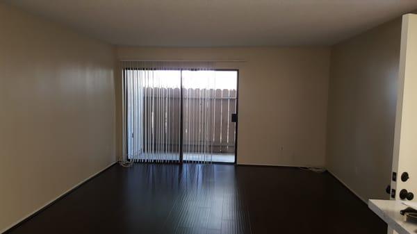 Different view of living room.  Very spacious with laminate wood flooring!