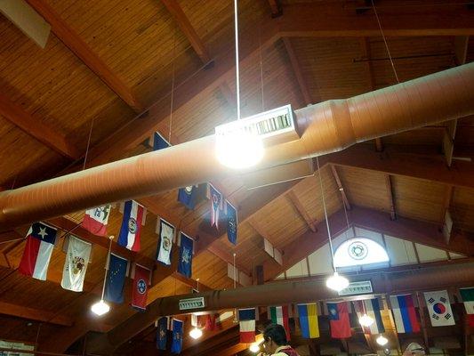 In the dining hall, flags hang from every state and country campers have visited from. Many more are hung.