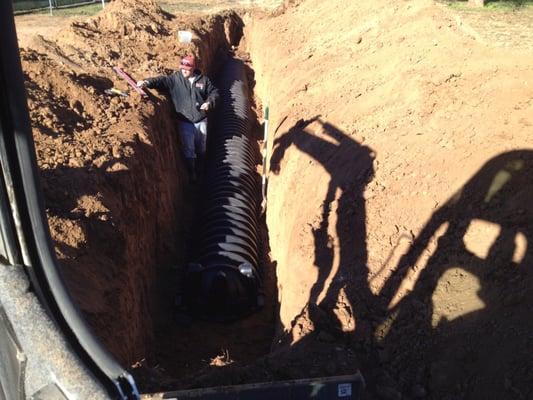 Installing an Infiltrater septic leach system.