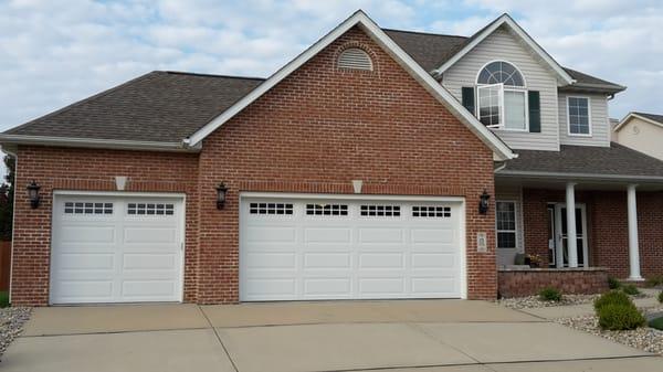 A pair of new garage doors that were just installed 12- 2 -2015