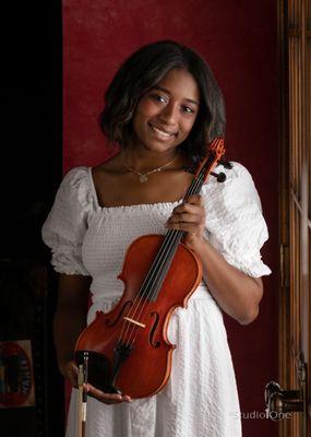 Girl holding violin for Senior Portrait