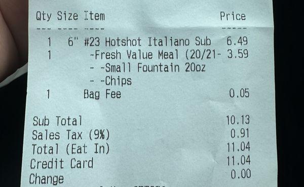 A Bag Fee of $0.05 to walk out with their brown paper bag. Also you can see inflated prices for a 6 inch meal. March 2024.