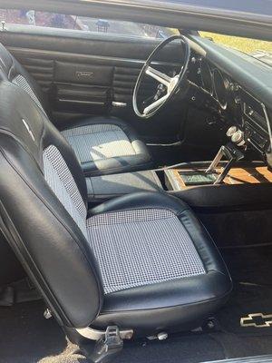 Houndstooth black and white with pro touring beefier boosterish front seat cushions.