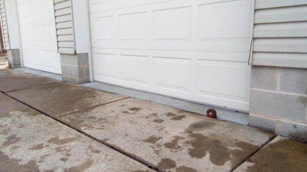 After: Driveway raised to level with garage entry.