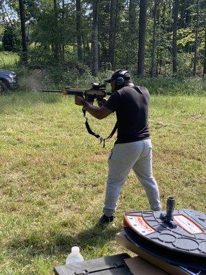 In the series of pictures of this young is shooting an AR 15 for the first time 
He is shooting a HK MR555A1