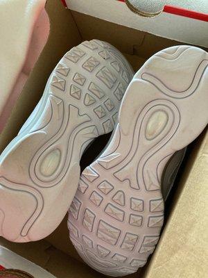 Dirty soles of brand new shoes in box with no paper either