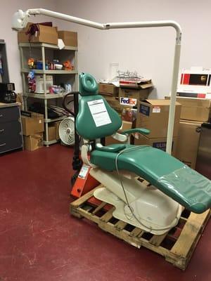 Dentist chair getting ready to shrink wrap and pack for shipment