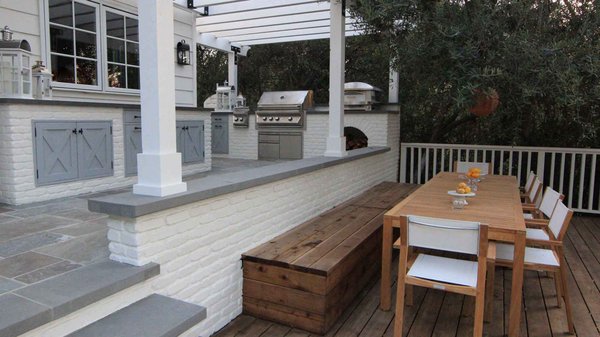 Gather guests around the BBQ grill and socialize as dinner is being prepared