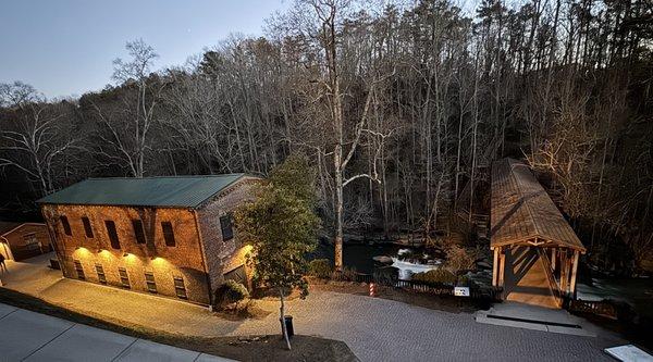 night view of old mill and covered bridge