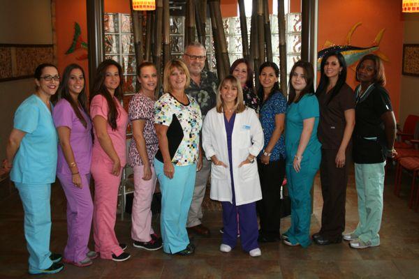 Dr. Patricia Gonzalez Templeton and Dr. Richard L. Sherman, pediatric dentists and staff