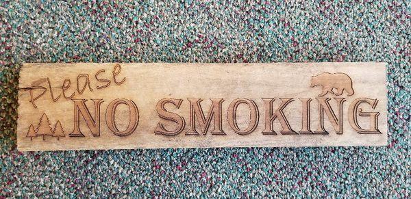 "No Smoking" signs for local cabin rental company  3" × 14"