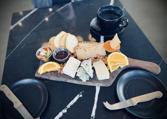 Rebel Cheese board with 3 cheeses, tomato paté,  habanero jam, pickled veggies, mixed nuts, crostinis & crackers