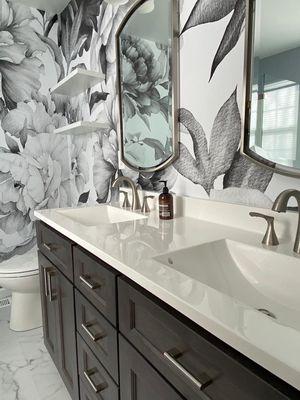 Transformed this bathroom oasis: new vanity, stunning floors, and a touch of elegance with fresh wallpaper!