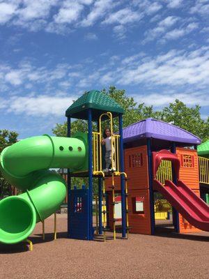 Enjoying the playground on a beautiful spring day.