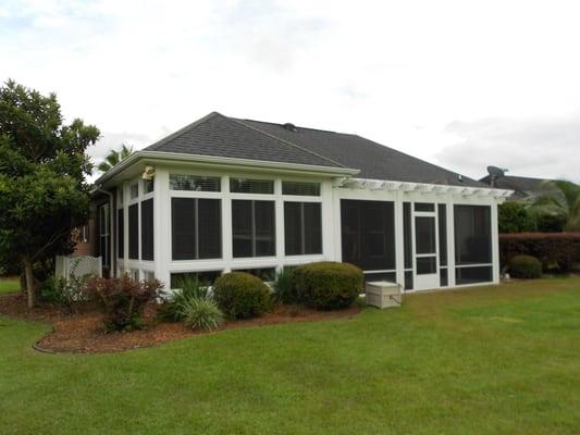 Floor to Ceiling windows enclosed their existing porch.  New Pergola was screened in to keep out the bugs.