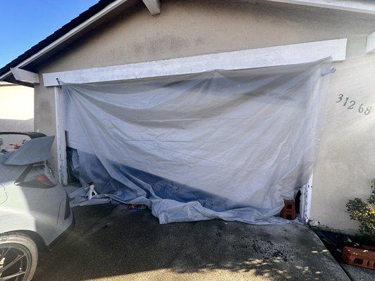 Garage door open, off track and would not close