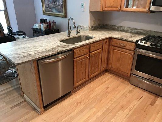 Refinished oak cabinets and built and installed granite counter tops