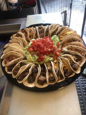 Brisket, sausage, beef fajita, chicken fajita and pirata Sample platter