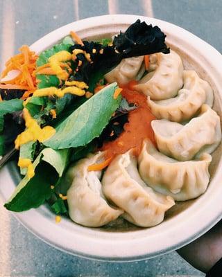 Momos with chicken, spicy sauce and salad. So good I almost got a second plate.