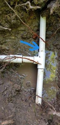 PVC pipe has a line break next PVC Tee fitting causing flooding.