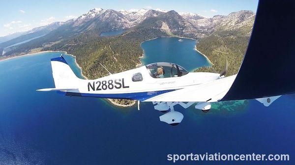 Airplane Light Sport Aircraft pilot training above Lake Tahoe Emerald Bay