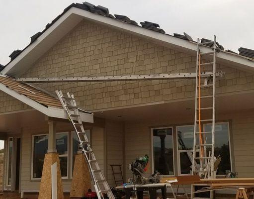 Hardi shake siding and regukat hardi boar Insulation along with soffit and facias